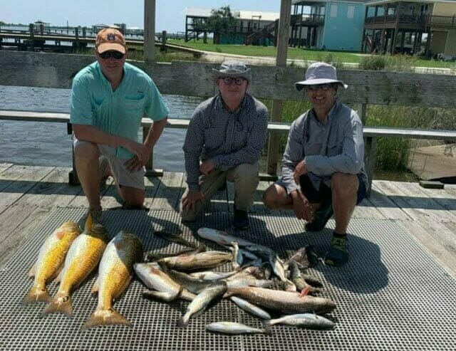 Clients attending the firm's annual fishing trip in Hackberry, Louisiana. 